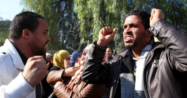 Unemployed graduates shout slogans during a demonstration to demand the government for job opportunities, in front the Assembly of People"s Representatives in Tunis, Tunisia, January 27, 2016