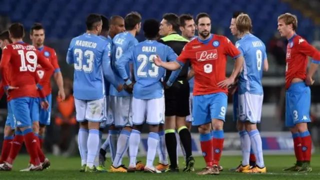 players surround referee after stoppage