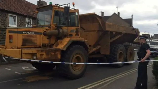 Dumper truck with police tape