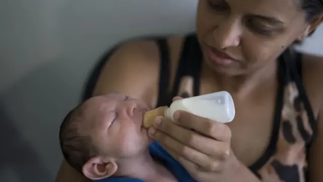 Brazilian woman with her son who suffers from microcephaly