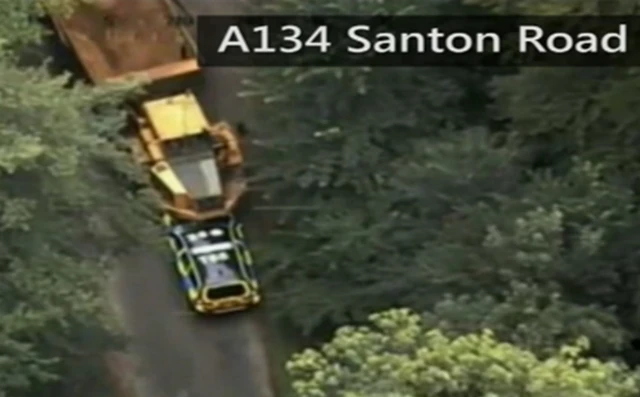 Dumper truck crushing police car