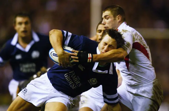 Simon Danielli is tackled by Ben Cohen in 2004