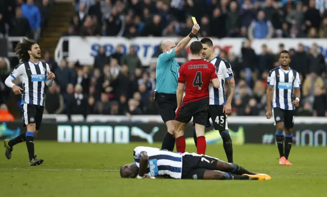 West Brom's James Chester is booked for a foul on Moussa Sissoko