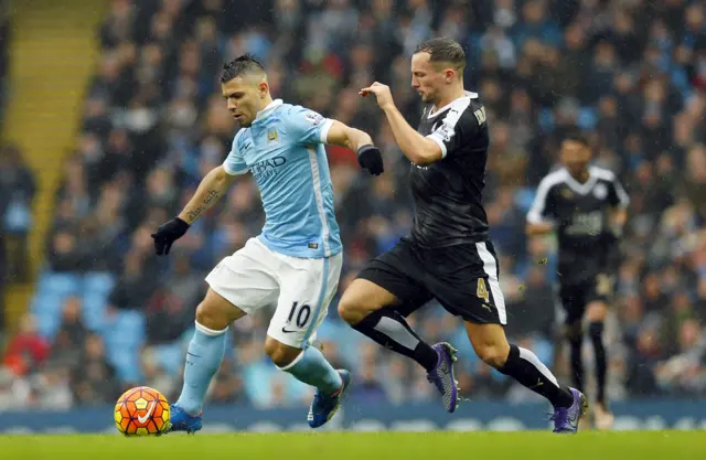 Manchester City's Sergio Aguero in action with Leicester City's Daniel Drinkwater