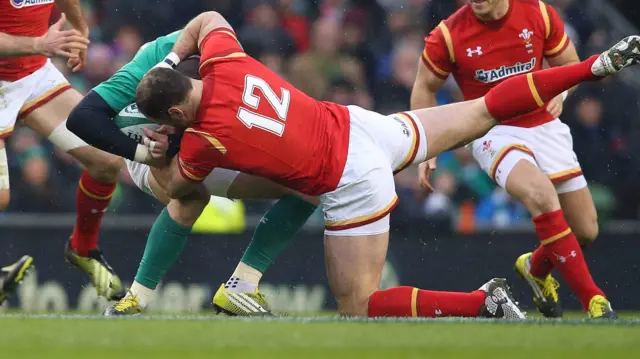 Jamie Roberts tackles Robbie Henshaw