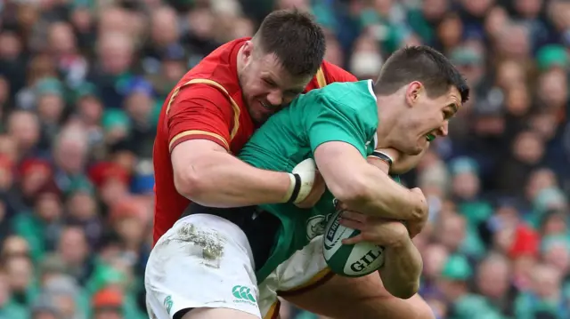 Jonny Sexton is tackled