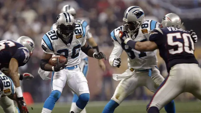 DeShaun Foster carries the ball in Super Bowl XXXVIII