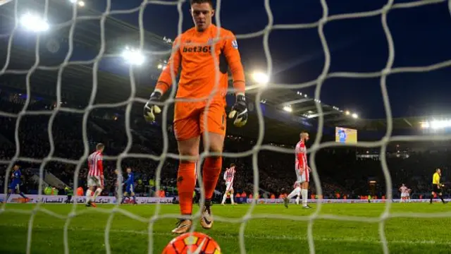 Jack Butland of Stoke City walks to pick up the ball