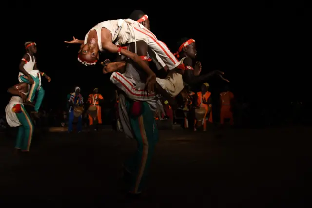 boy does a backflip in bissau