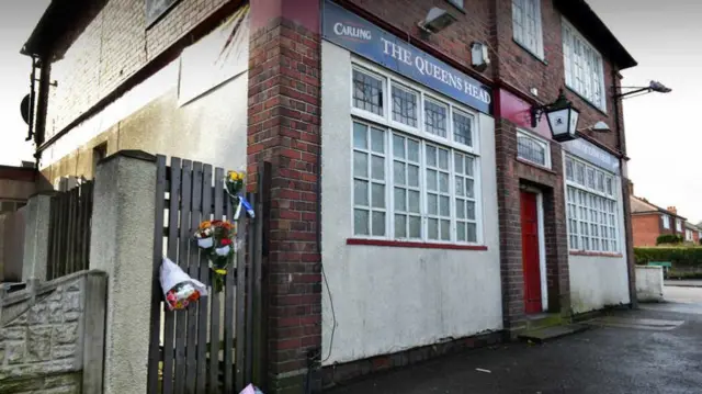 Flowers left outside the Queens Head pub