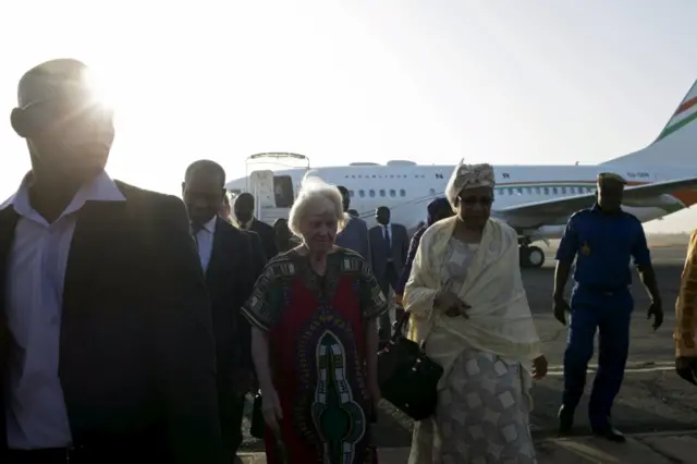 Freed hostage Jocelyn Elliott (C), who was kidnapped with her husband in Burkina Faso by a group affiliated to al Qaeda, arrives in Ouagadougou, Burkina Faso, February 8, 2016