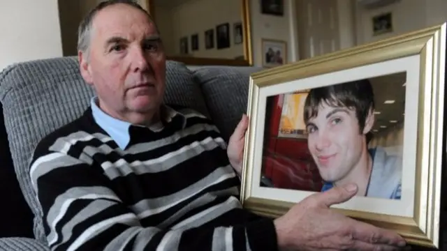 Graham Dytiche with a picture of his son Andrew, who died on a building site in 2011