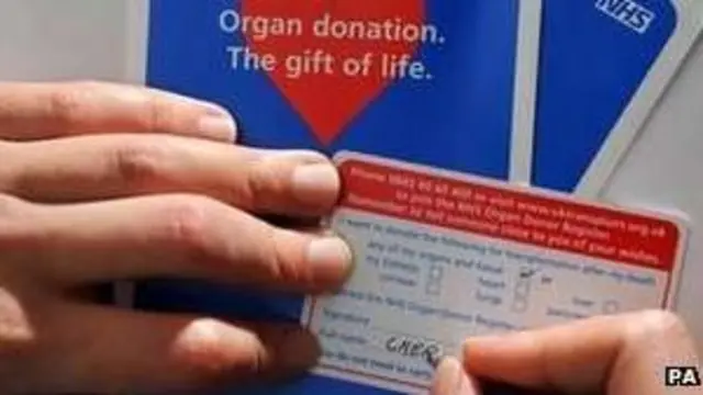 Man completing donor card