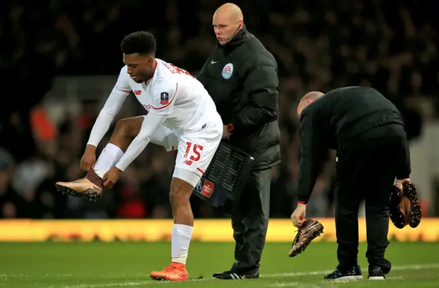 Daniel Sturridge changes his boots