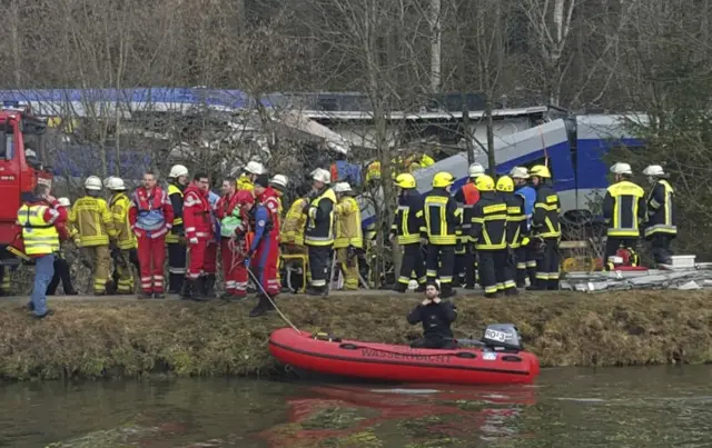 Rescue workers next to the train crash