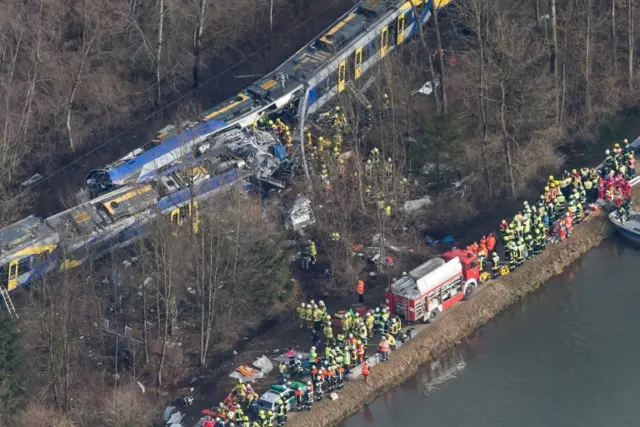 Overview of crash scene and rescuers