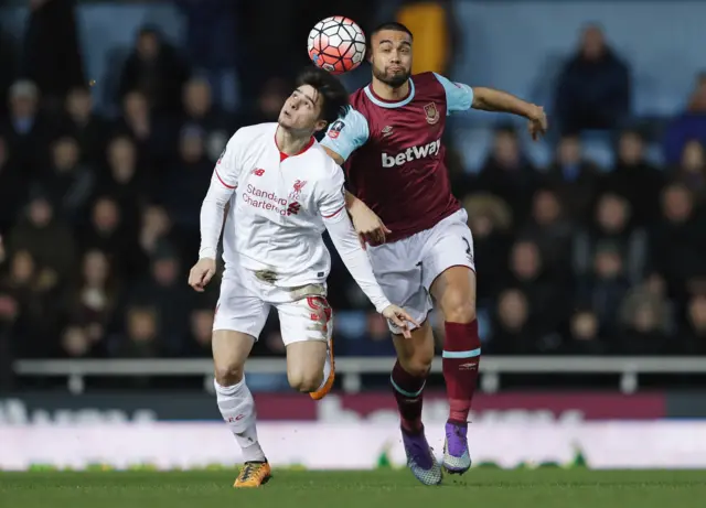 Liverpool's Joao Carlos Teixeira in action with West Ham's Winston Reid