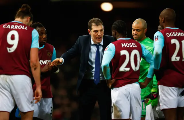 Slaven Bilic talks to his team