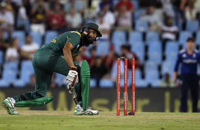 Hashim Amla watches his shot