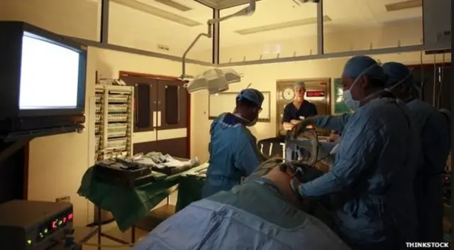 Surgeons carrying out a transplant