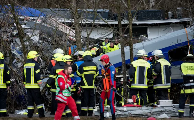 Rescue teams work at the site of a train accident near Bad Aibling, Germany, on 9 February 2015