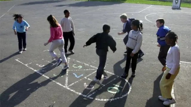 Children playing hopscotch