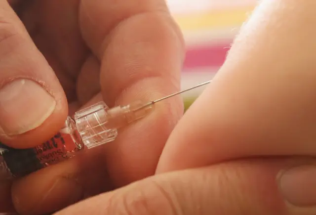 Person receiving vaccination