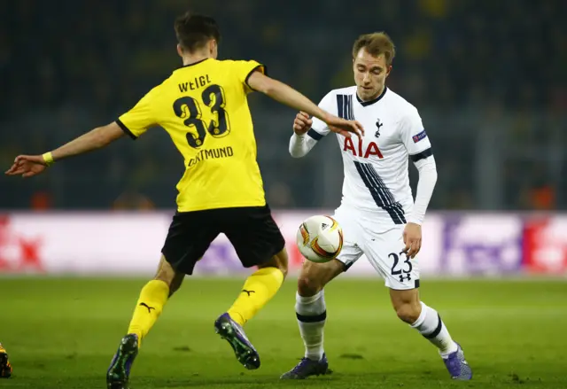 Christian Eriksen challenges for the ball