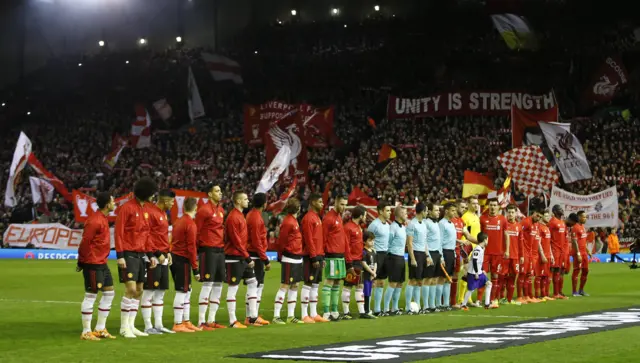 The teams enter the pitch