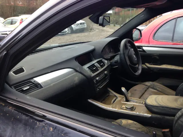 Inside of a car covered in mud