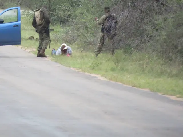 person in a bush, people standing up