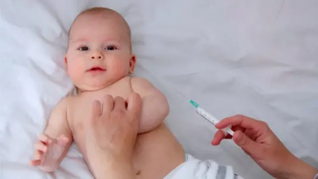 Baby receiving an injection