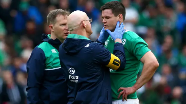 A medic checks on Johnny Sexton