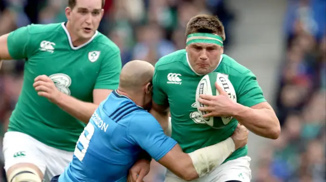 Ireland's CJ Stander is tackled by Sergio Parisse