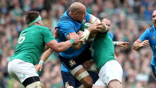 Sergio Parisse is tackled