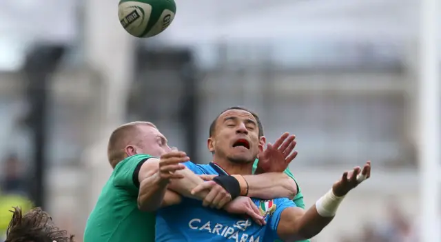 Italy's David Odiete is tackled by Keith Earls of Ireland