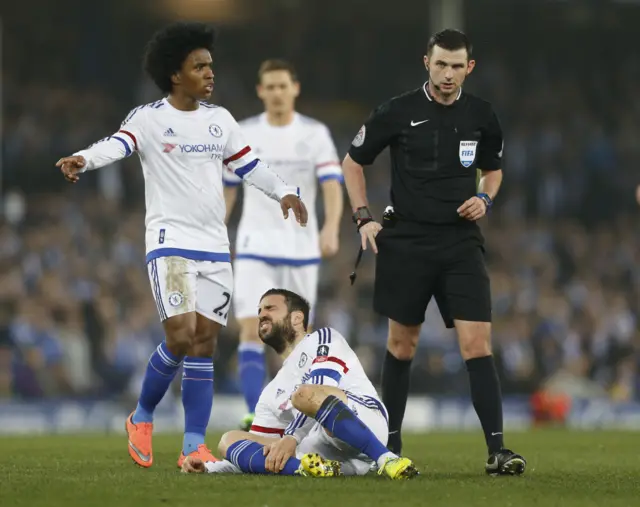 Cesc Fabregas reacts after a challenge