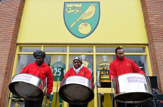 A steel band perform ahead of kick-off