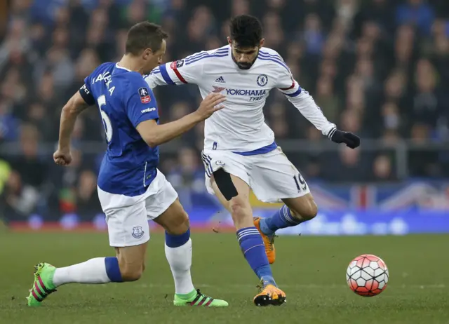 Phil Jagielka challenges Diego Costa