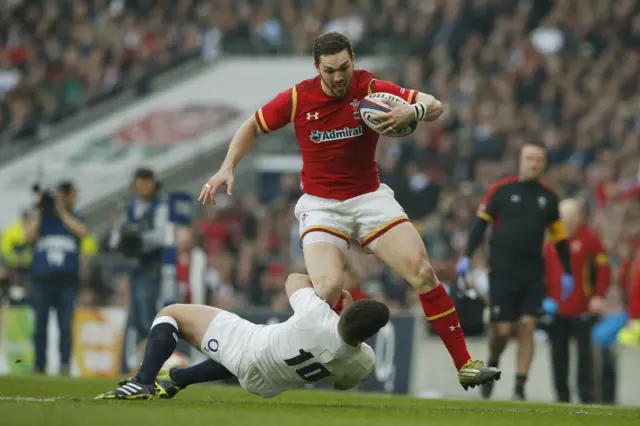 George North is tackled by George Ford