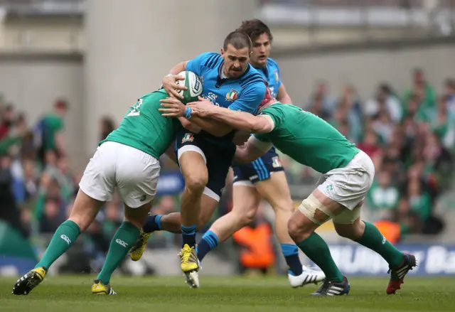 Italy's Mattia Bellini is tackled