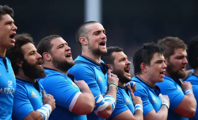 Italy's players sing the national anthem