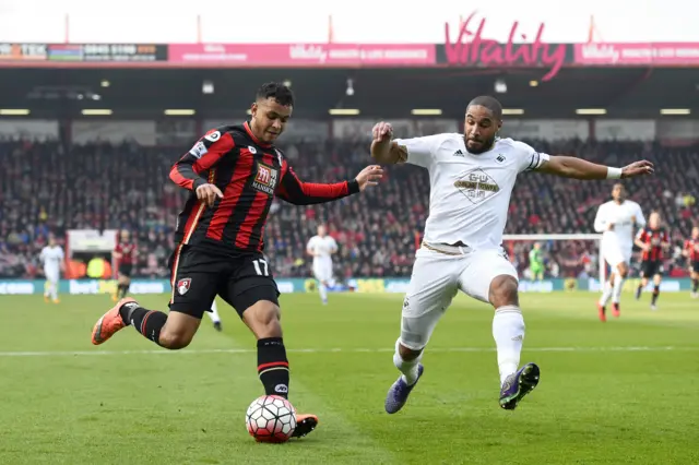 Joshua King battles with Ashley Williams