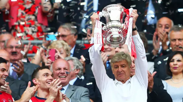 Arsene Wenger lifts the FA Cup