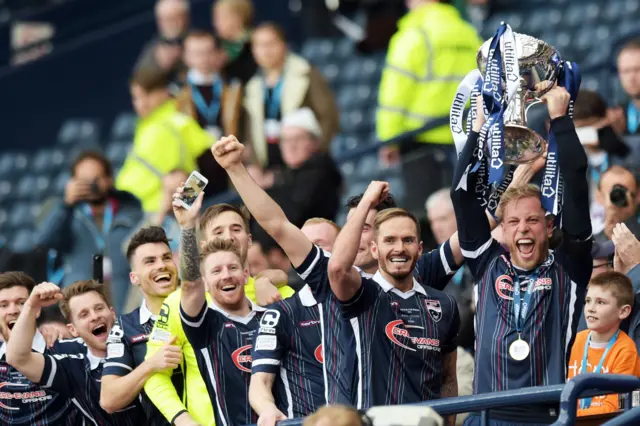 Ross County captain Andrew Davies lifts the Scottish League Cup