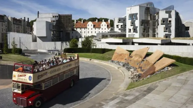 Sightseeing bus outside Holyrood