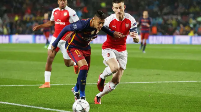 Neymar runs past Laurnet Koscielny