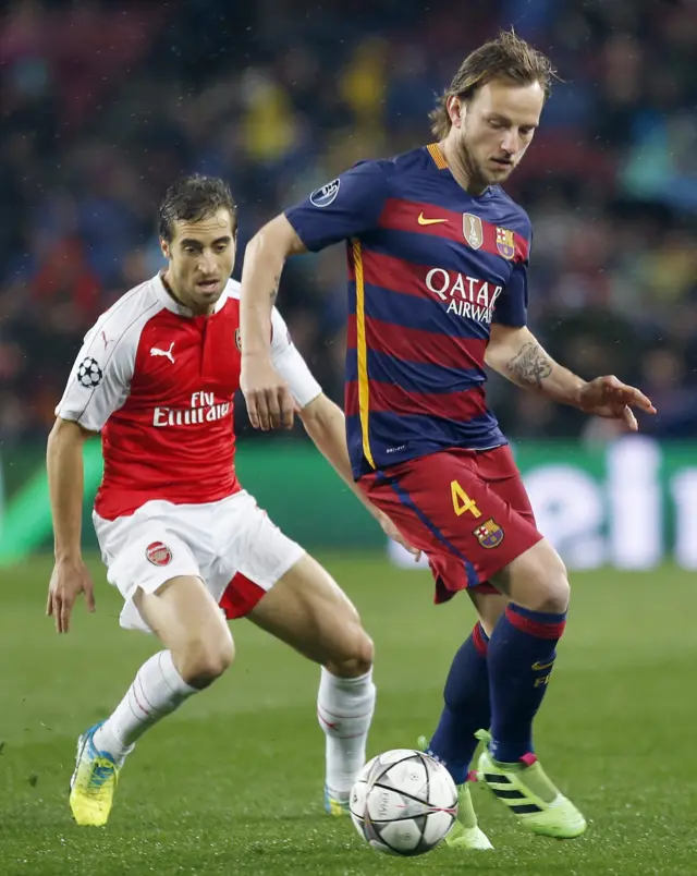 Barcelona's Ivan Rakitic and Arsenal's Mathieu Flamini