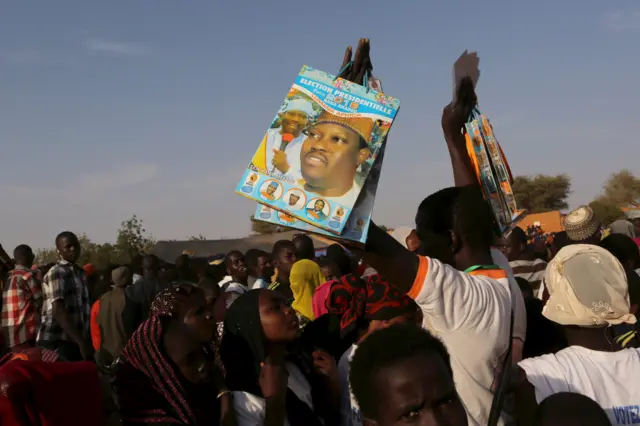 A vendor sells products bearing the image of incarcerated opposition candidate Hama Amadou at a campaign rally for Amadou in Niamey, Niger, February 17, 2016. Niger holds presidential and legislative elections on Sunday.