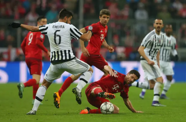 Juventus' Sami Khedira tackles Bayern's Xabi Alonso